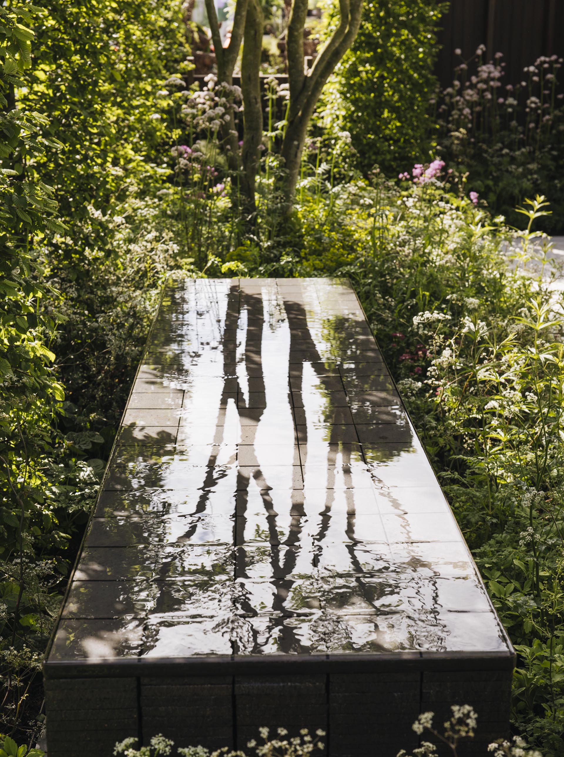 Ketley staffs blue quarry tiles in a water feature at RHS Chelsea by Alexandra Noble
